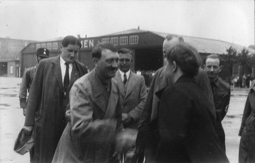 Adolf Hitler greets a woman at Bremen airport